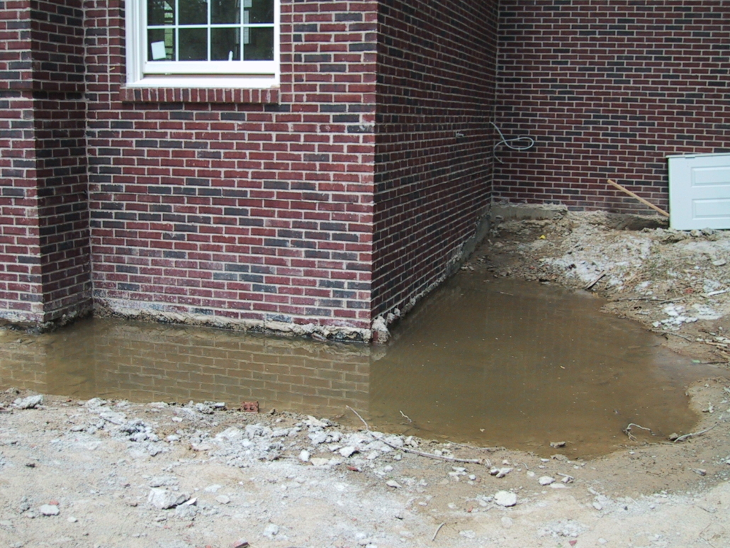 Why Water Pooling Round Your House Is a Critical Caution Signal